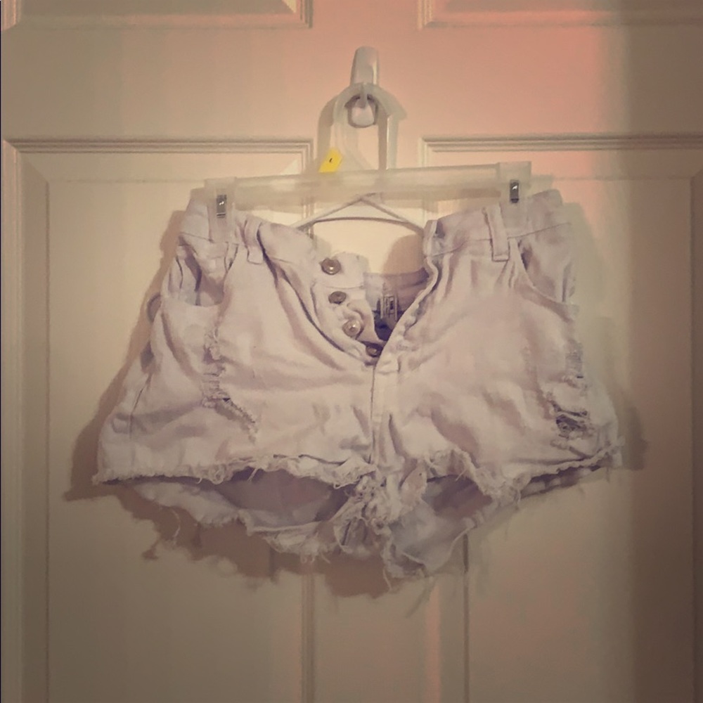 Distressed white shorts